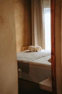 a pair of towels sitting on top of a bed at SAYA Coliving in El Paredón Buena Vista