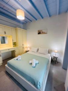 En eller flere senge i et værelse på Traditional Mansion in Mykonos