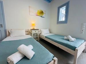 En eller flere senge i et værelse på Traditional Mansion in Mykonos + 21 billeder