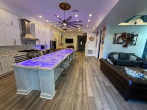 a kitchen and living room with a large counter top at Blue Crawfish Boutique Hotel & Pool Bar in New Orleans