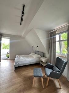 En eller flere senge i et værelse på Pensjonat Kapitan