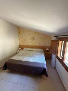 En eller flere senge i et værelse på La Badia