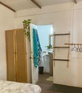 a room with an open door and an open refrigerator at Casa Costa Sirena in El Gigante