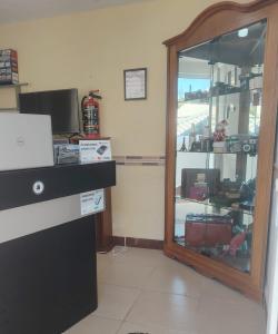 a room with a counter and a glass door at Casa Real Cortés in Mineral del Monte