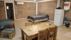 a room with a table and a bed and a table and chairs at RM RinconMoreno II in Colorado River