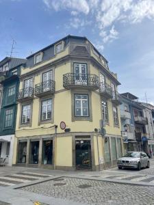 a building with a car parked in front of it at Ponte Romana in Chaves
