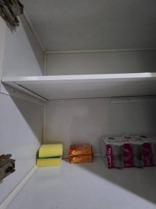 a shelf in a room with some bags and boots at Ajman Luxury Downtown B9OO7 in Ajman  +10 photos