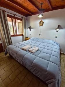 En eller flere senge i et værelse på Hotel & Restaurant Las Brisas