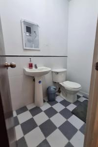 a bathroom with a sink and a toilet at Colonial Travel Popayán in Popayan +10 photos