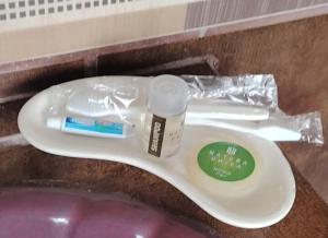 a toothbrush and toothpaste sitting on top of a sink at Casa Real Cortés in Mineral del Monte +32 photos