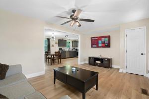 a living room with a couch and a table at Carbon Ridge 300mbps WiFi - Dog Friendly in Oak Grove