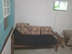 a chair in the corner of a room at Espaço Dtalia in Piedade