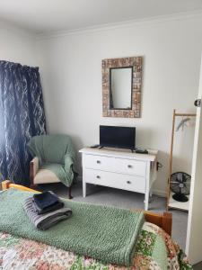 Et tv og/eller underholdning på Bridge Street Homestay + 14 billeder