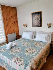 Giường trong phòng chung tại Hostal Punto Austral