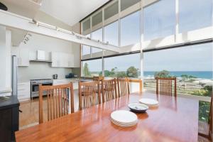 a large kitchen and dining room with a large window at The Dreamery in Apollo Bay