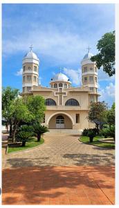 a large building with two domes on top of it at Pouso Canastra - Chalés in São João Batista do Glória