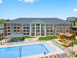 an aerial view of a hotel with a swimming pool at Roark Home Suites - Branson Landing, Gym, Indoor Pool in Branson