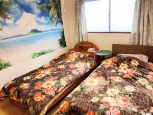 En eller flere senge i et værelse på Futami Terrace C