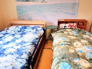 En eller flere senge i et værelse på Futami Terrace C