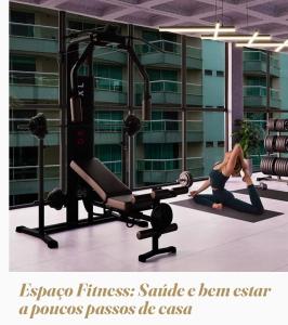 two people in a gym doing a plank exercise at Flat novo próximo ao Hard Rock in Itapema