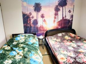 En eller flere senge i et værelse på Futami Terrace B