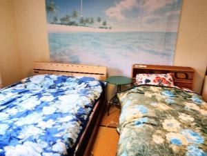 En eller flere senge i et værelse på Futami Terrace B