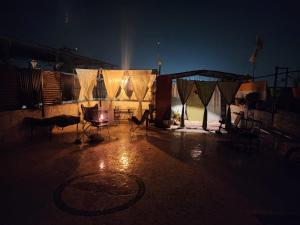 a dark room with chairs and a tent at night at Hathai in Jodhpur +18 photos