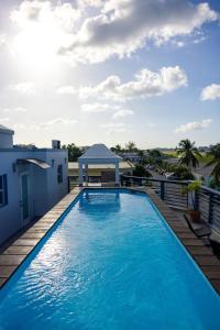 a large swimming pool on a balcony with a gazebo at BethsAida Conference Center & Boutique Accommodations in Simpson Bay