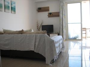Ein Bett oder Betten in einem Zimmer der Unterkunft SeaFront Apartment Marsascala