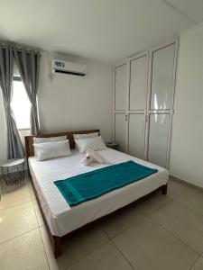 En eller flere senge i et værelse på Green Village Duplex