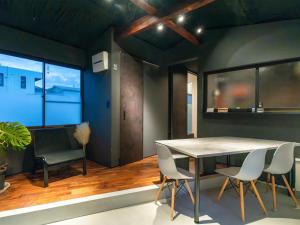 a dining room with a table and chairs at Rino-Haku 03 in Anan +31 photos