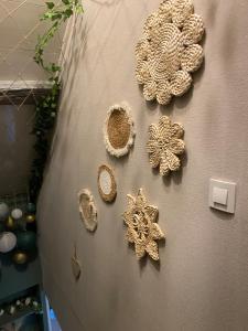 a wall with a bunch of decorations on it at Au Pied de Troncais in Coust +41 photos