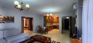 a living room with a couch and a table at Spacious Waterfront 3BR - 2Bath & 3 Panoramic Balconies - Pogradec, Lake Ohrid in Pogradec