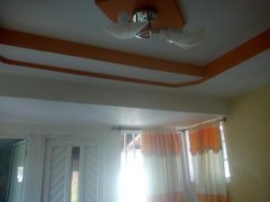 a room with a ceiling fan and a window at double room # 2 in San Andrés