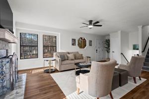 a living room with a couch and a table at Chic & Comfy Stay Close to Everything in Marietta