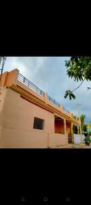a building with a fence on top of it at M R ViLLA HAMPI magic rock villa in Hampi