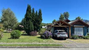 a car parked in front of a house at Los Castaños Pucón in El Cerrillo