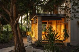 a building with a balcony on top of it at Amrani Diamond Beach Villas & Pool in Nusa Penida