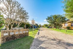 a street with a speed limit sign on a road at The Unit Lennox Head in Lennox Head