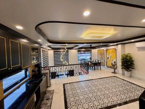 a living room with a kitchen and a dining room at Cat Ba Cam's Villa in Cat Ba