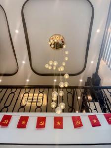 a chandelier hanging from the ceiling in a room at Cat Ba Cam's Villa in Cat Ba