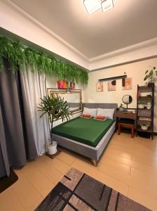 Giường trong phòng chung tại Casa Tagpuan at Manhattan Heights +20 ảnh