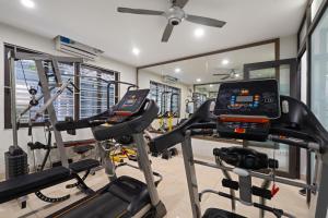 a gym with two treadmills and two ellipticals at Nagomi Residence in Hanoi +86 photos