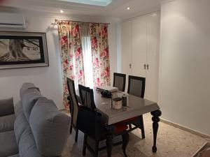 a living room with a table and a couch at Antonio del Toro in Lora del Río +2 photos
