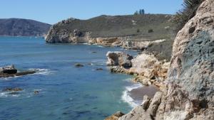 a view of a beach with rocks and the ocean at Rye Motor Inn - Oceanfront, Walk to Beach in Rye