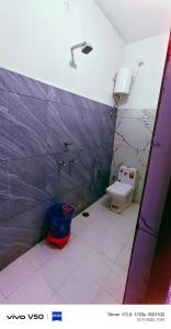 a bathroom with a sink and a toilet at Vishal guest house in Juliāsar