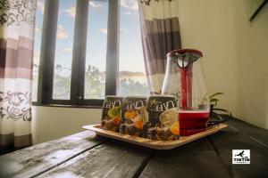 a tray of food on a table with a blender at Tin Tin Lodge in Ella +26 photos