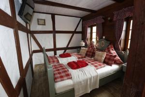a bedroom with a bed with red pillows on it at Apartment Grubenhaus20 in Freiberg