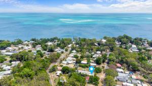an aerial view of a town with houses and the ocean at 1/24 Birch Street in Amity Point
