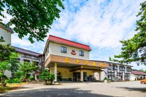 a building with chinese writing on the side of it at IkazawaYumotokan in Minami Uonuma